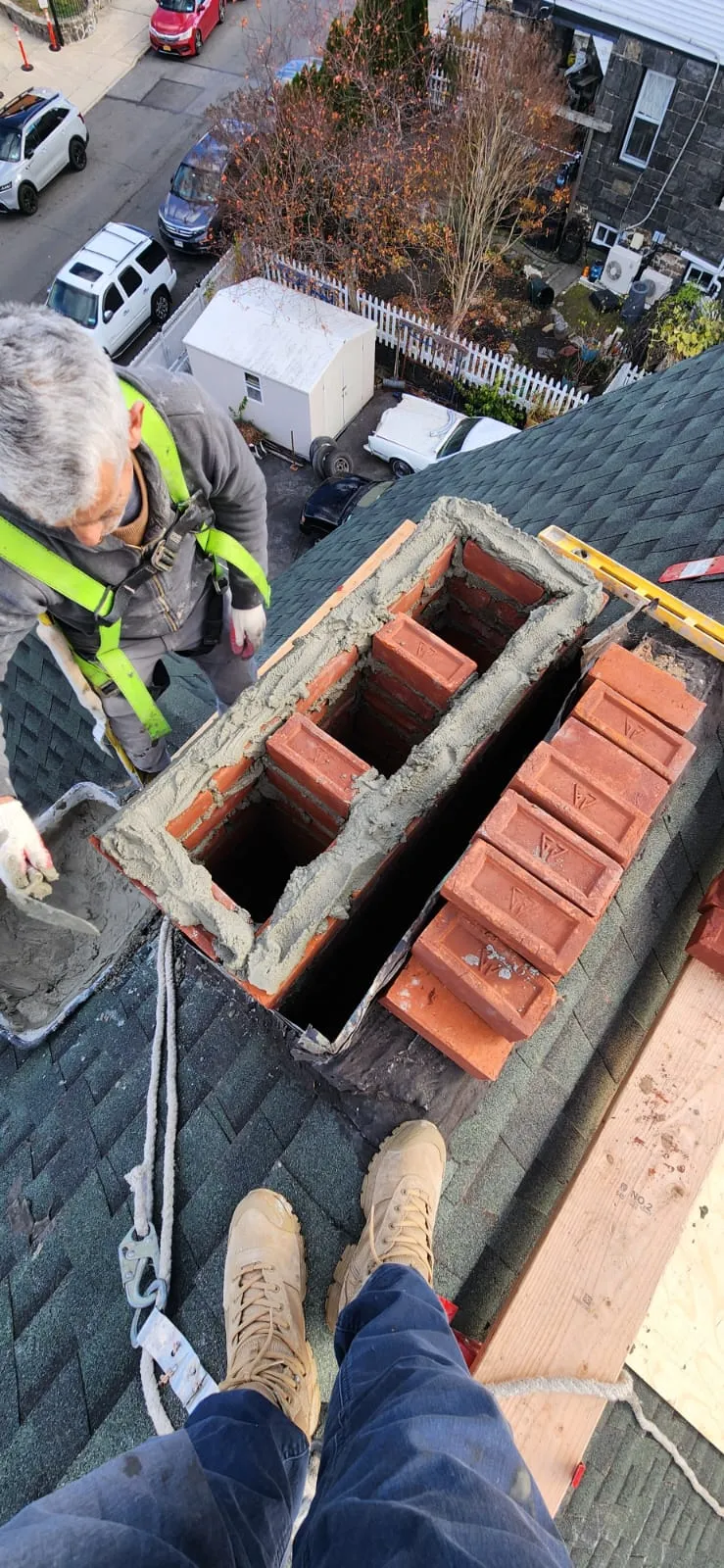 Chimney replacement during roof renovation project in Bronx NY