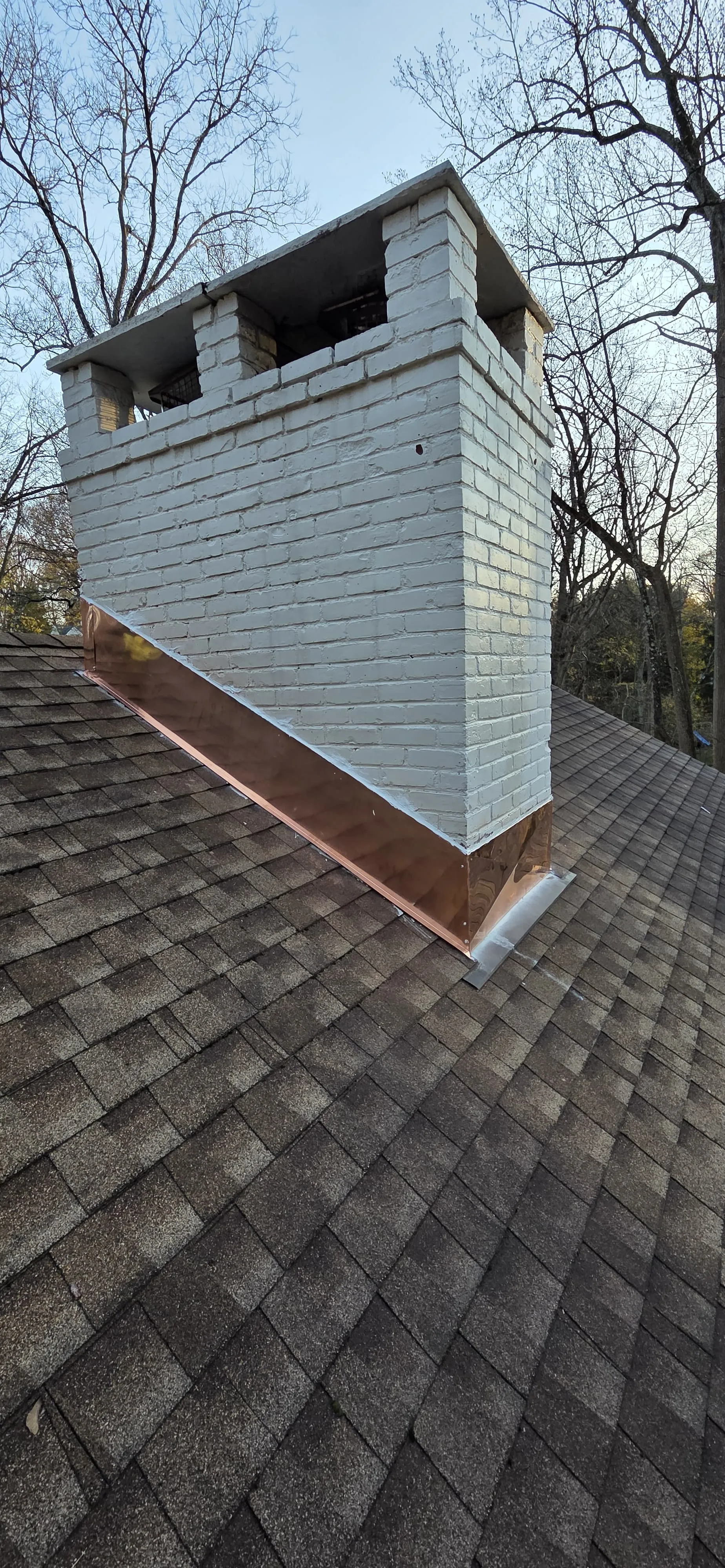 Finished chimney repair with restored brickwork
