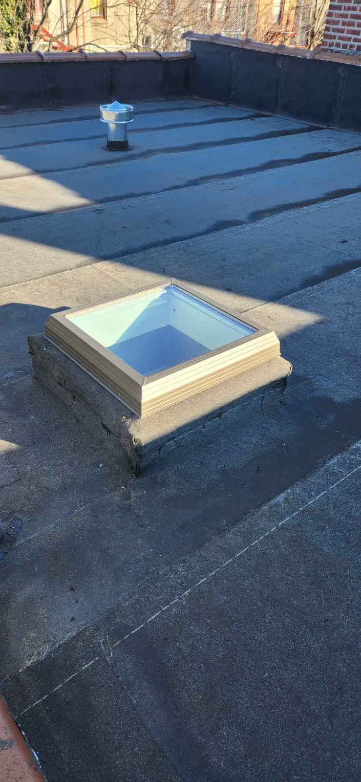 Completed flat roof installation with waterproof finish