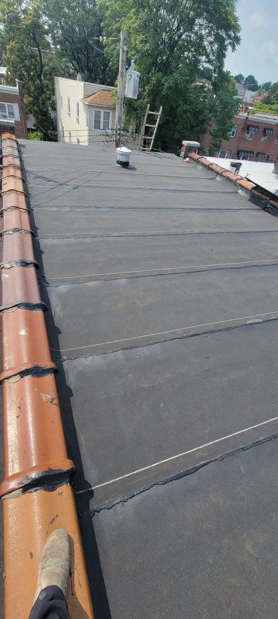 Flat roof installation work on Bronx residential building