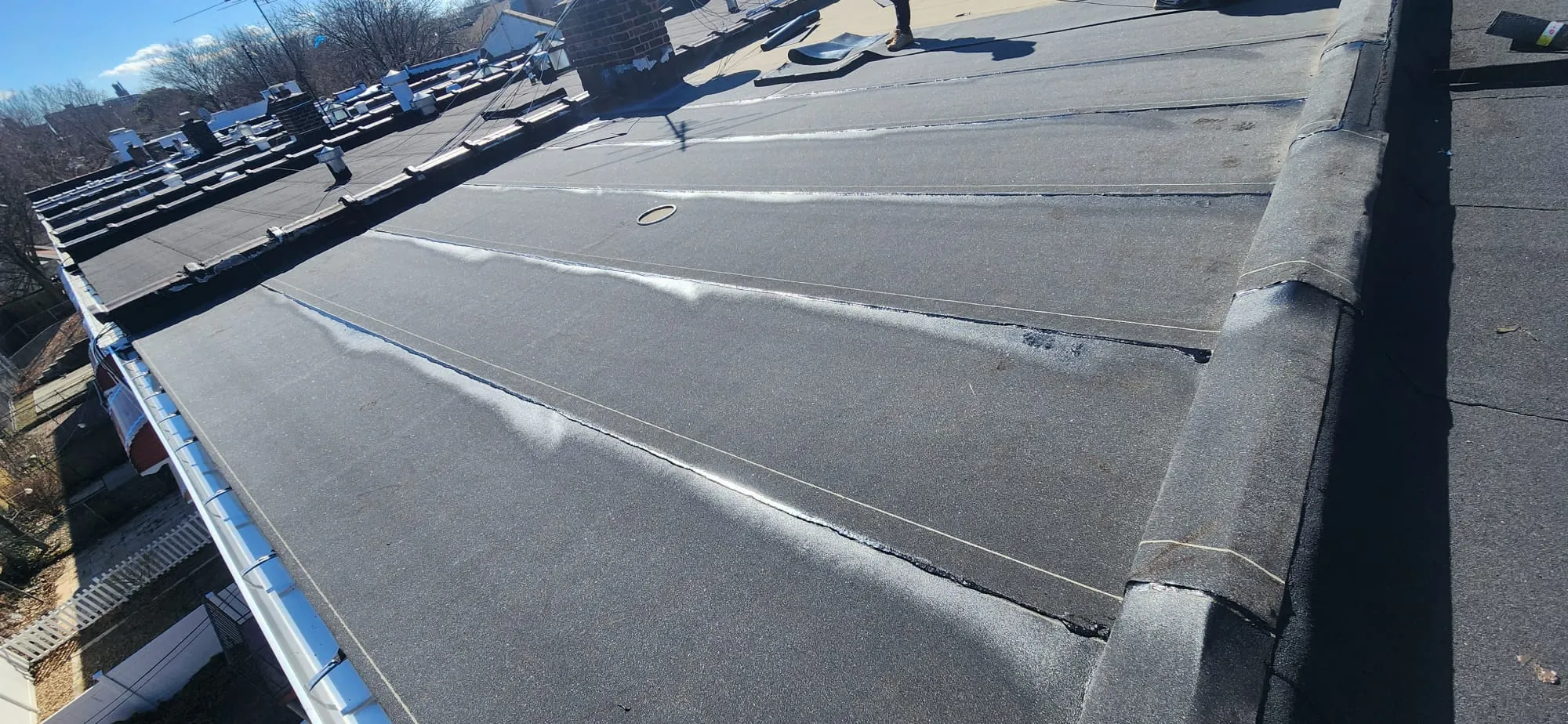 Flat roof installation showing slope and drainage design