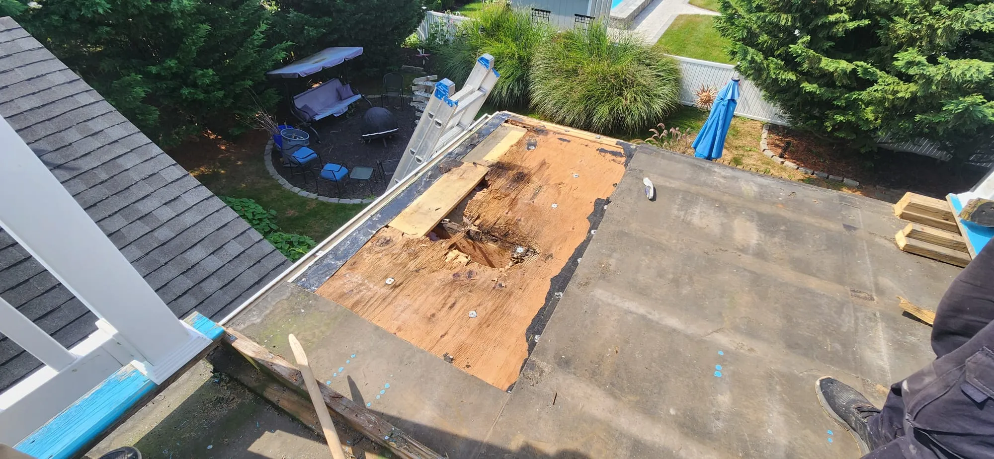 Flat roof repair addressing leaks and damage