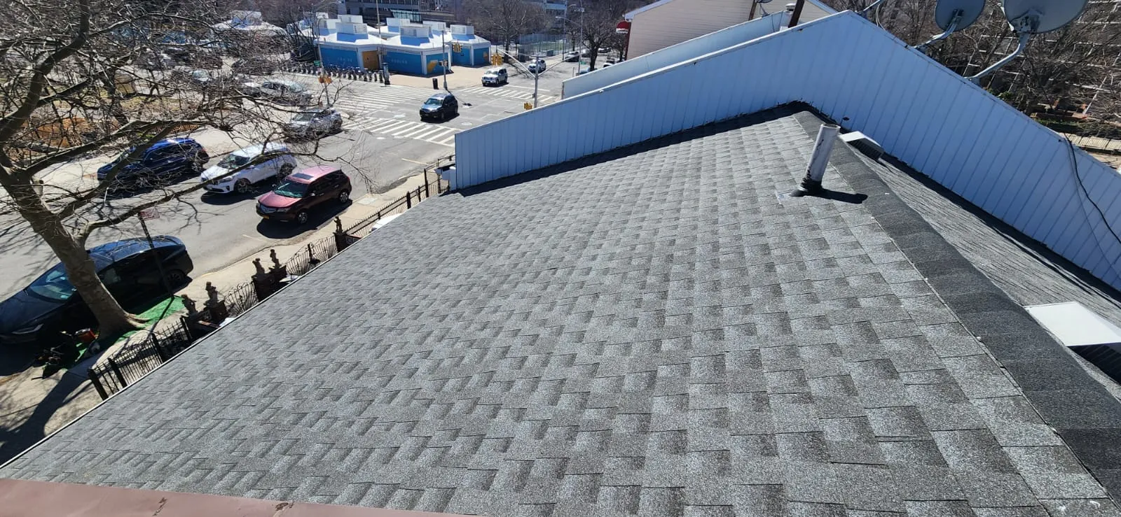 Shingle roof ridge and slope installation view