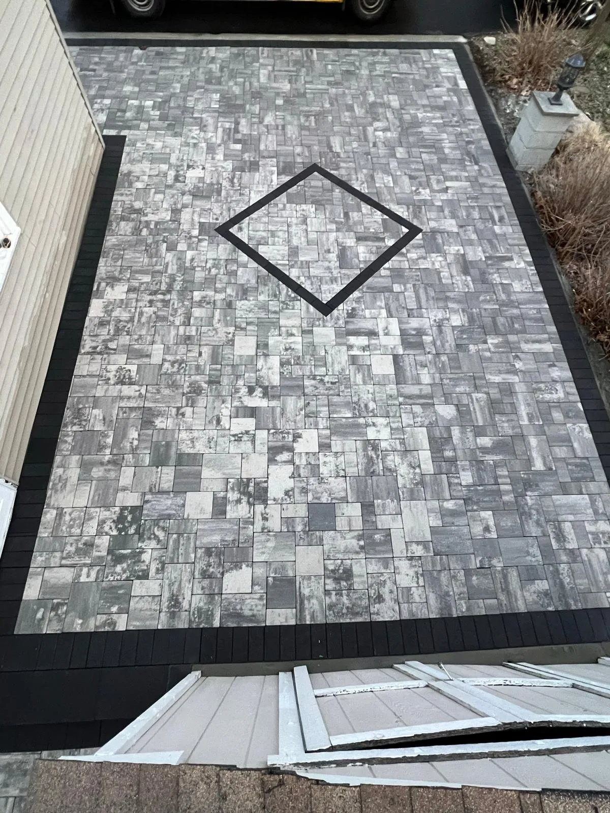 Sidewalk masonry work with concrete finish