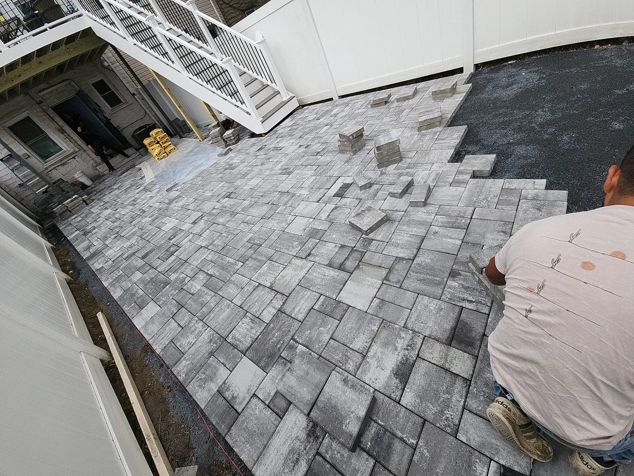 Sidewalk paver installation for outdoor walkway